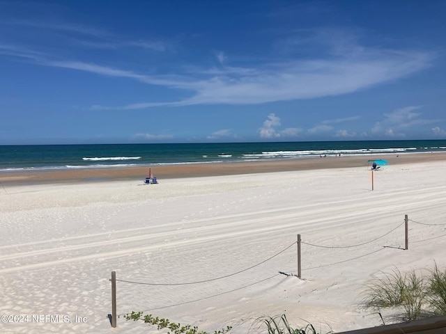 view of water feature with a beach view