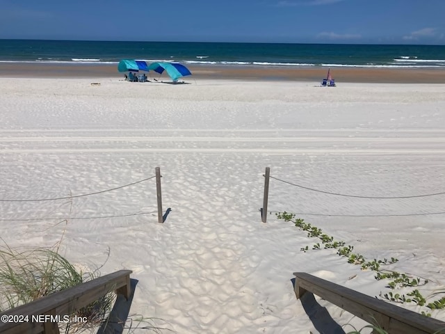 view of water feature with a beach view