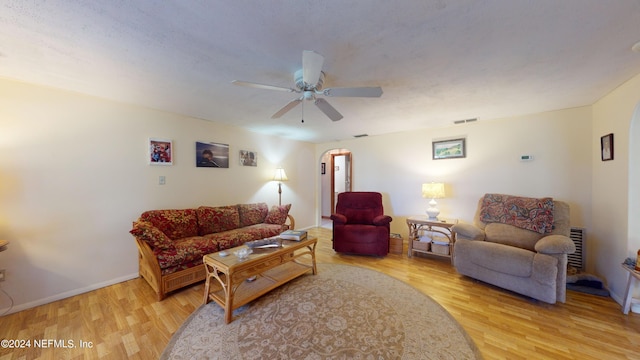 living room with ceiling fan and light wood-type flooring