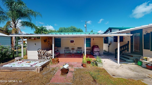 rear view of house featuring a patio area