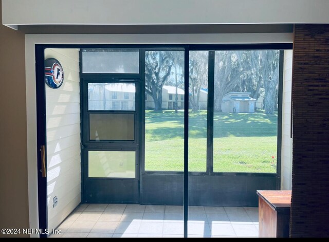 entryway with tile patterned flooring and a wealth of natural light