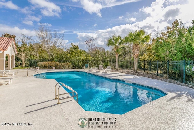 view of swimming pool with a patio area