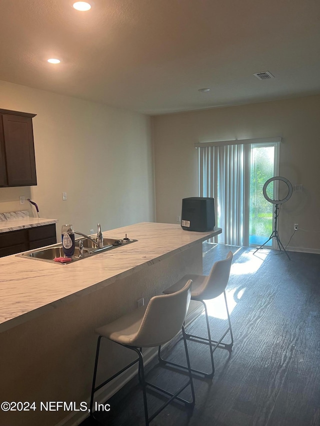 kitchen featuring recessed lighting, cooktop, light countertops, visible vents, and baseboards