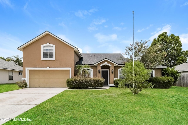 view of front of house with a garage and a front lawn