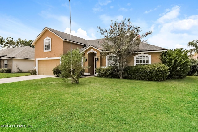 view of front of house featuring a garage and a front yard