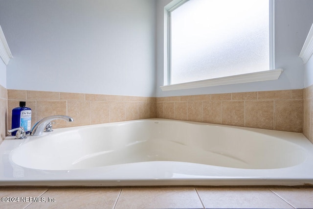 bathroom with tiled bath