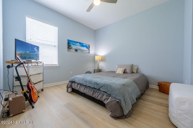 bedroom featuring light hardwood / wood-style flooring and ceiling fan