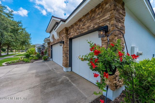 view of side of home with a garage