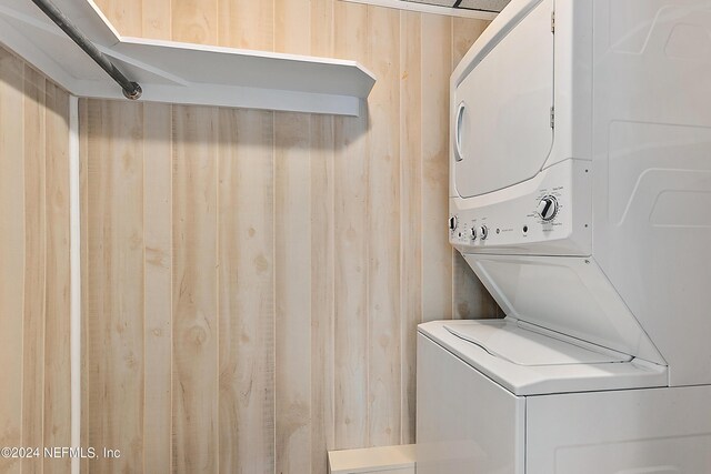 laundry room featuring stacked washing maching and dryer