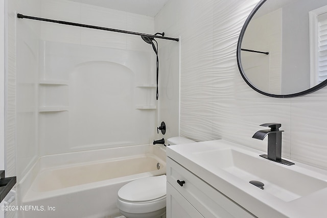 full bathroom featuring toilet, vanity, tile walls, shower / washtub combination, and backsplash