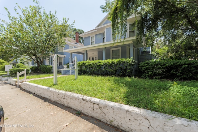 view of front of home with a front yard