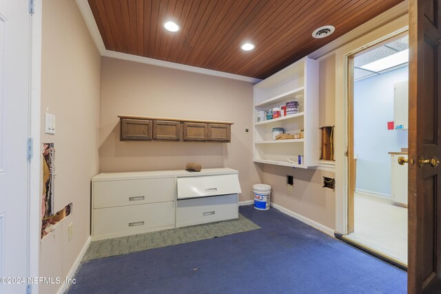 carpeted home office with wooden ceiling, built in features, and crown molding