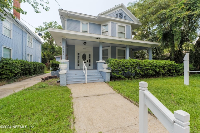 victorian home featuring a porch and a front yard