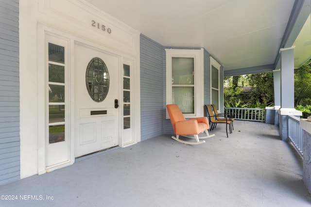 doorway to property with a porch