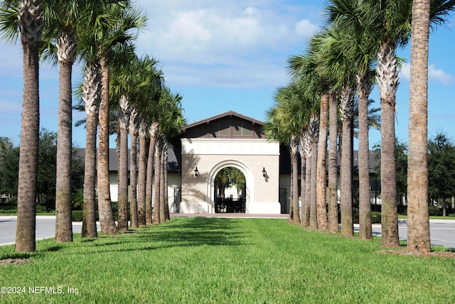 exterior space featuring a front yard and stucco siding