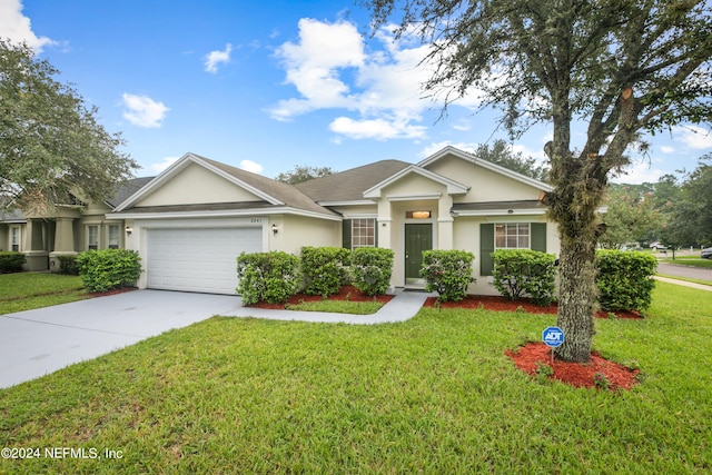 view of front facade featuring a front lawn and a garage