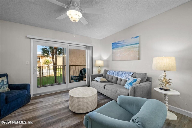 living room with hardwood / wood-style floors, a textured ceiling, and ceiling fan