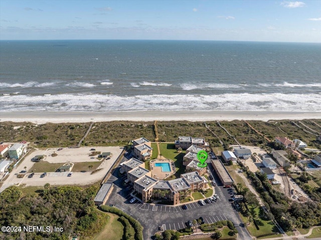 bird's eye view featuring a beach view and a water view