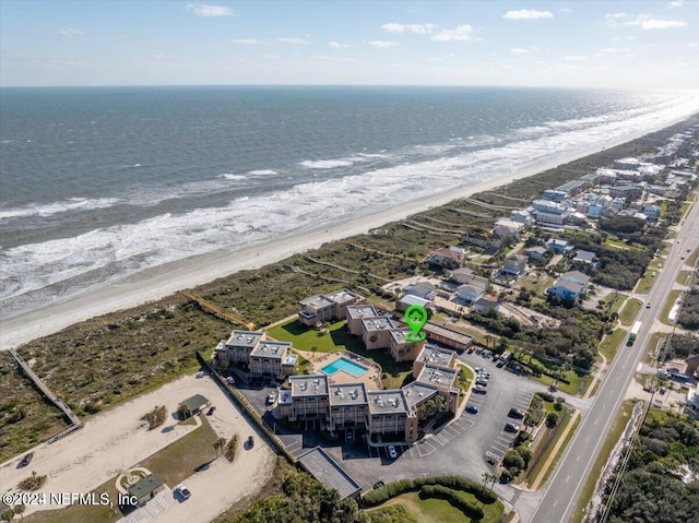 aerial view with a water view and a view of the beach