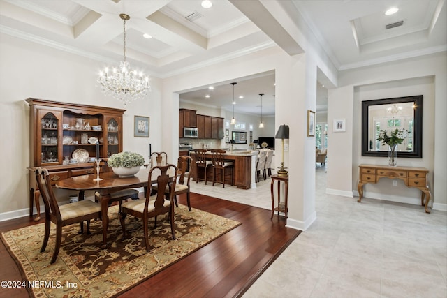 tiled dining room with beam ceiling, a notable chandelier, crown molding, and coffered ceiling