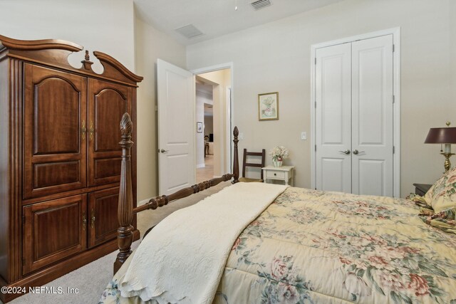 bedroom featuring a closet and carpet