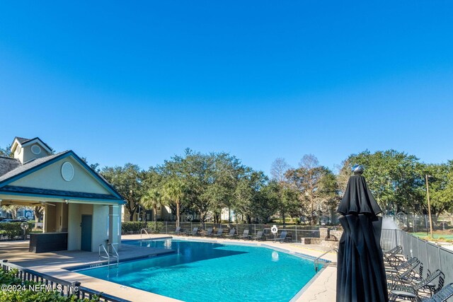 view of pool featuring a patio