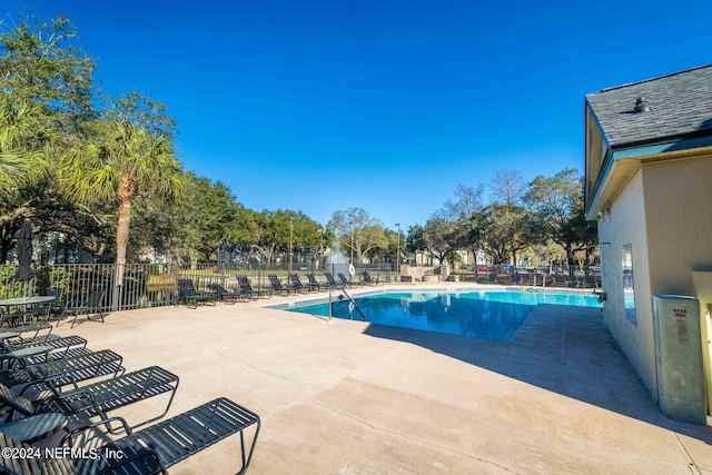 view of swimming pool featuring a patio area