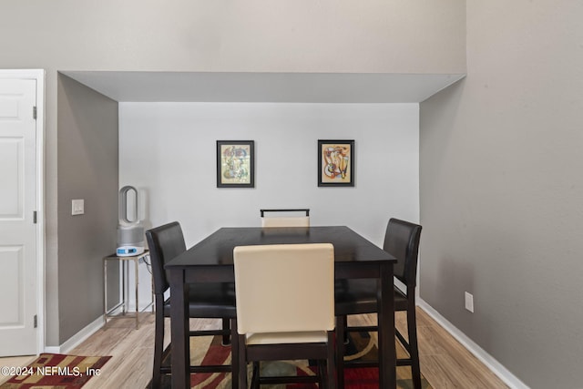 dining room featuring light hardwood / wood-style floors