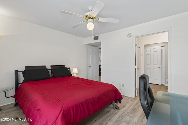 bedroom with ceiling fan and light hardwood / wood-style flooring