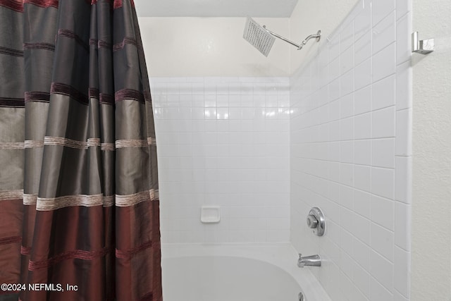 bathroom featuring shower / bath combo with shower curtain