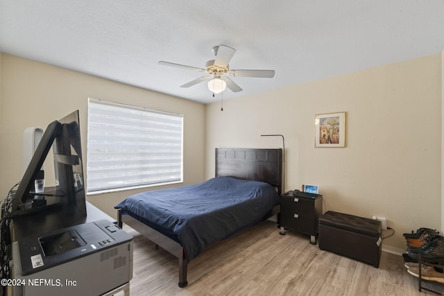 bedroom featuring ceiling fan and light wood-type flooring