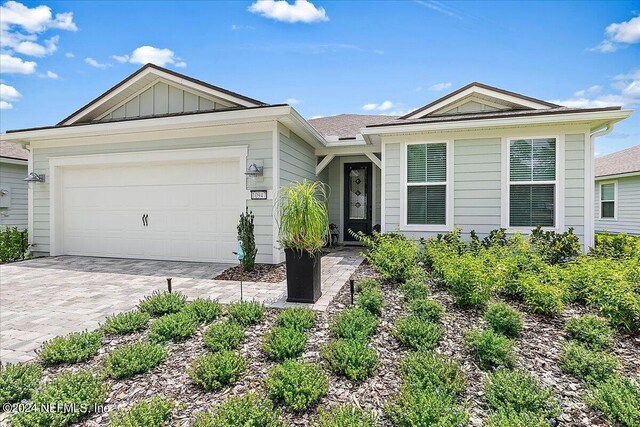 single story home featuring a garage