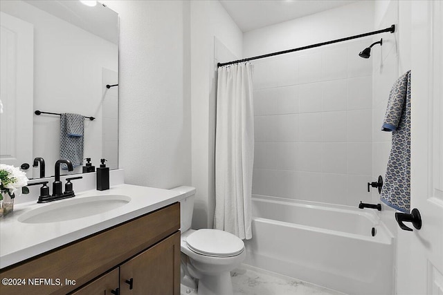 full bathroom with toilet, marble finish floor, vanity, and shower / tub combo with curtain