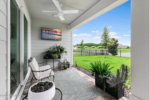 view of patio / terrace featuring a fenced backyard and a ceiling fan