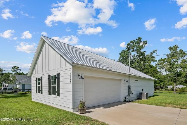 view of side of property with metal roof, a yard, board and batten siding, and central air condition unit