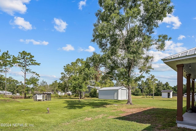 view of yard featuring an outbuilding and a storage unit