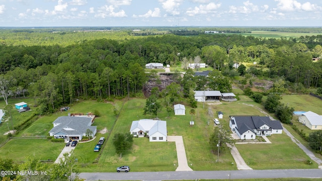 birds eye view of property with a wooded view