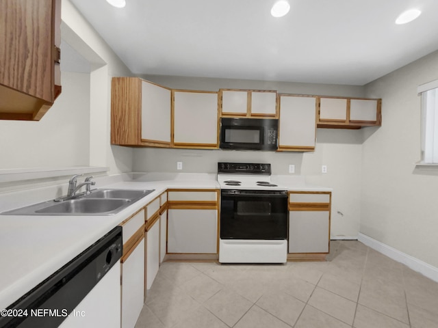 kitchen featuring sink, white cabinets, light tile patterned floors, electric range, and white dishwasher