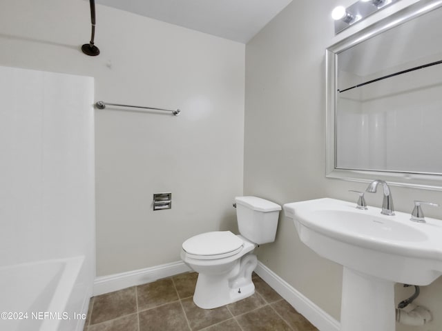 bathroom with sink, tile patterned floors, and toilet