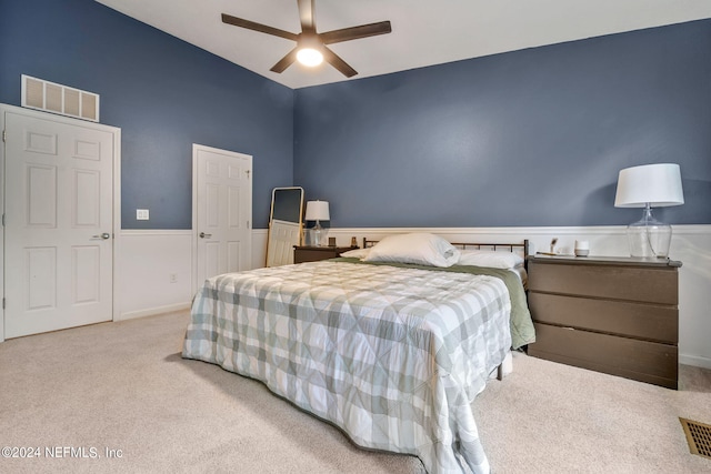 bedroom featuring ceiling fan and light colored carpet