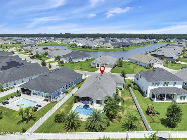 birds eye view of property with a water view