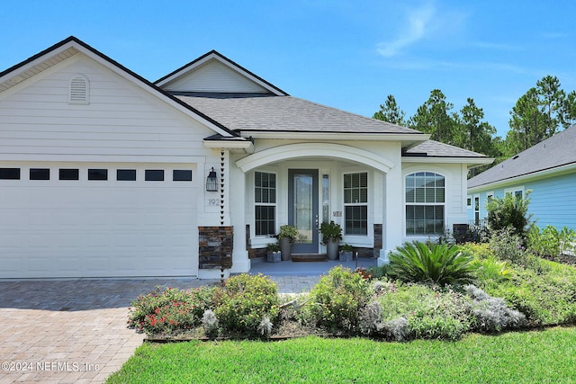 ranch-style home featuring a garage