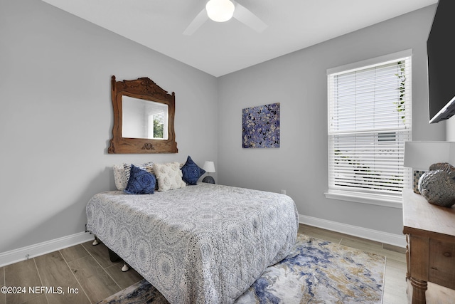 bedroom featuring hardwood / wood-style flooring and ceiling fan