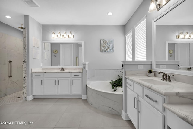 bathroom featuring tile patterned floors, vanity, and separate shower and tub