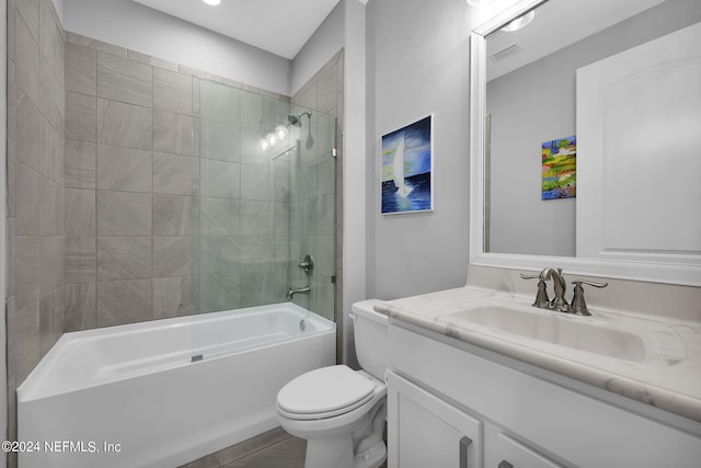 full bathroom with vanity, toilet, and tiled shower / bath combo