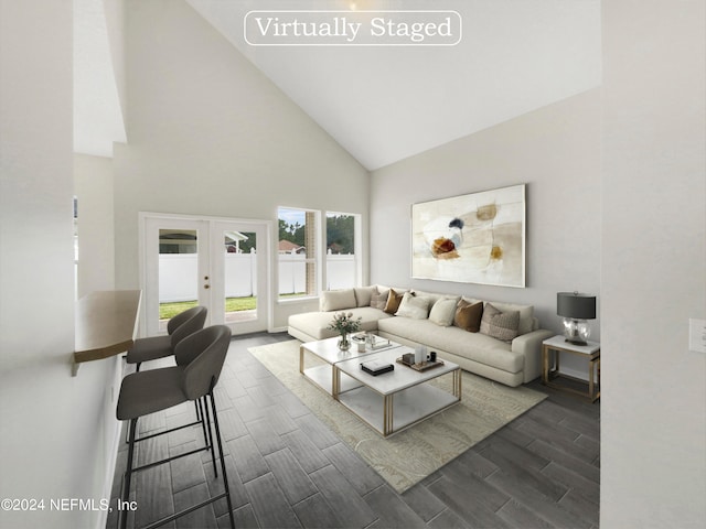 living room featuring french doors, dark hardwood / wood-style flooring, and high vaulted ceiling