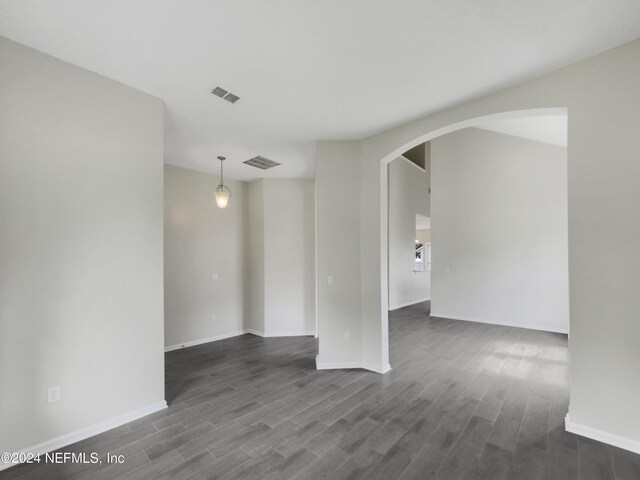 empty room with hardwood / wood-style floors