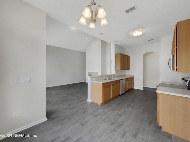 kitchen with decorative light fixtures, stainless steel appliances, hardwood / wood-style floors, sink, and vaulted ceiling