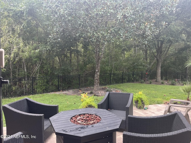 view of patio / terrace with a fire pit