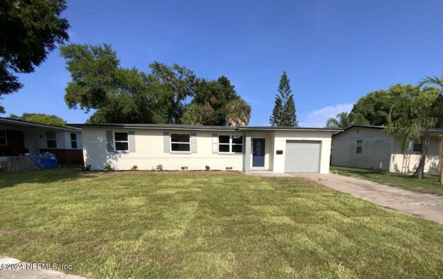 single story home with a garage and a front yard